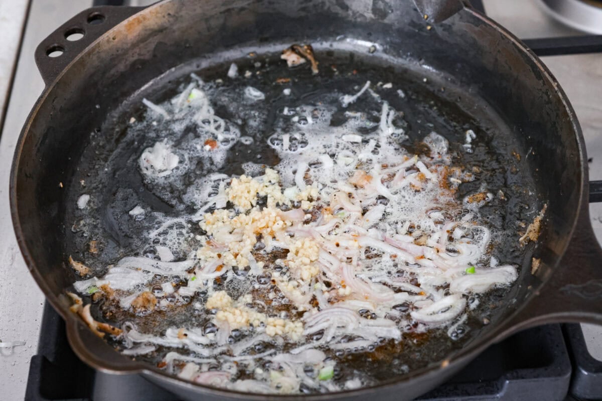 Shallots and garlic cooking in the butter and chicken drippings in the skillet. 