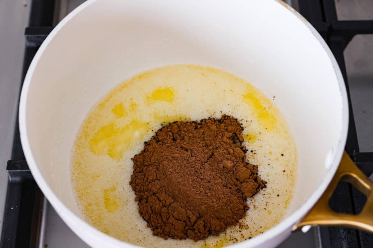 Melted butter and cocoa powder together in a saucepan. 