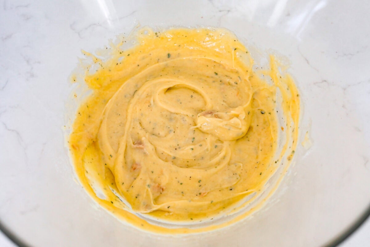Ranch seasoning mixed with cream of chicken soup in a bowl.