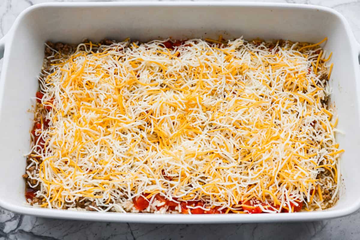 This is about to change your taco game forever! No shell needed! This dump-and-go taco rice is so easy and made with just 6 ingredients. Throw it together, top it your way, and boom, you’ve got a totally unique and delicious taco night! Everything mixed together and topped with cheese.