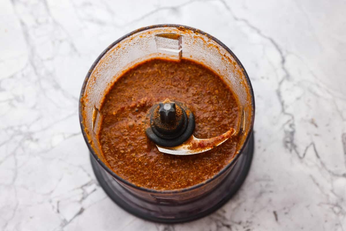 Slow cooker barbacoa beef simmers all day in smoky chipotle, tangy lime, and warm spices until it falls apart. It’s perfect for tacos, burritos, bowls, or nachos, all with that taquería-style flavor at home. All of the sauce ingredients blended up in a food processor.