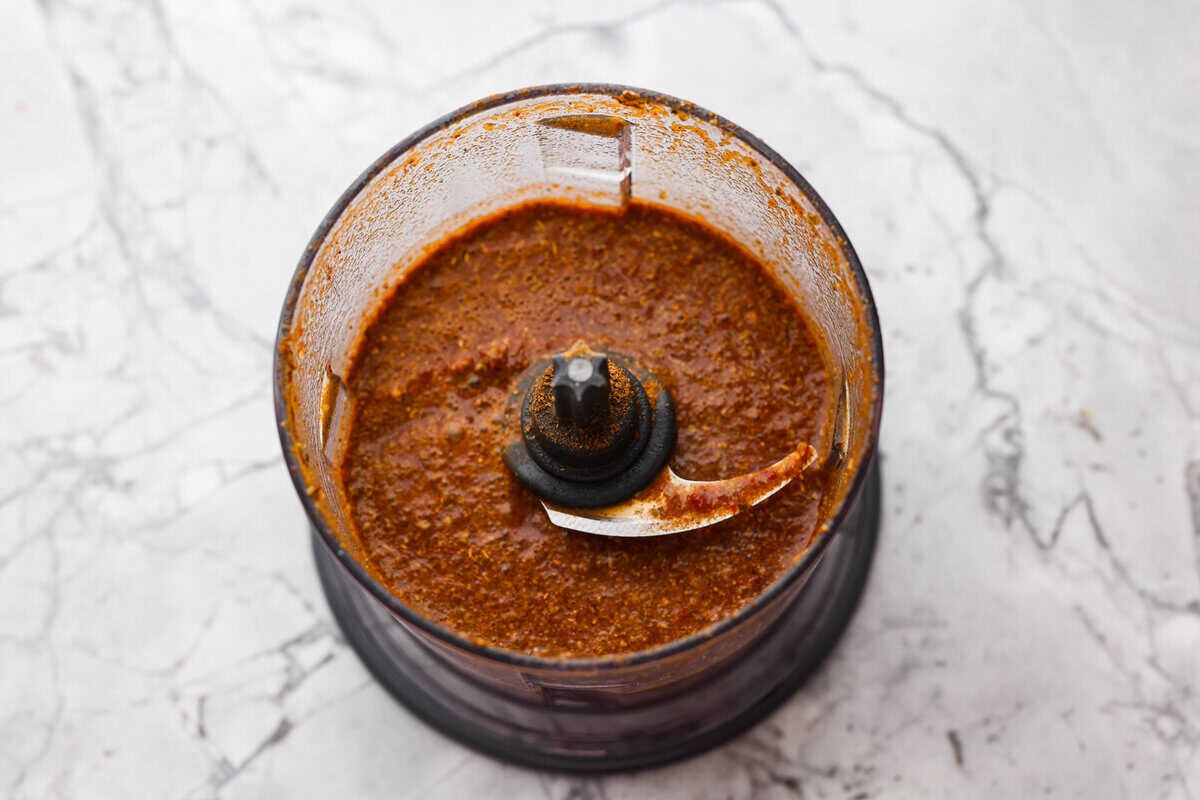 Slow cooker barbacoa beef simmers all day in smoky chipotle, tangy lime, and warm spices until it falls apart. It’s perfect for tacos, burritos, bowls, or nachos, all with that taquería-style flavor at home. All of the sauce ingredients blended up in a food processor.