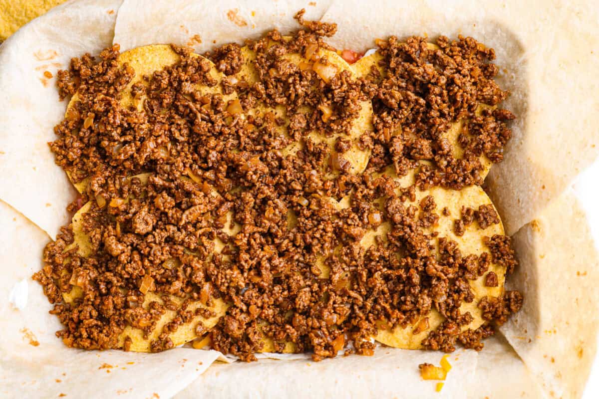 Seasoned ground beef layered over the top of the tostada shells. 