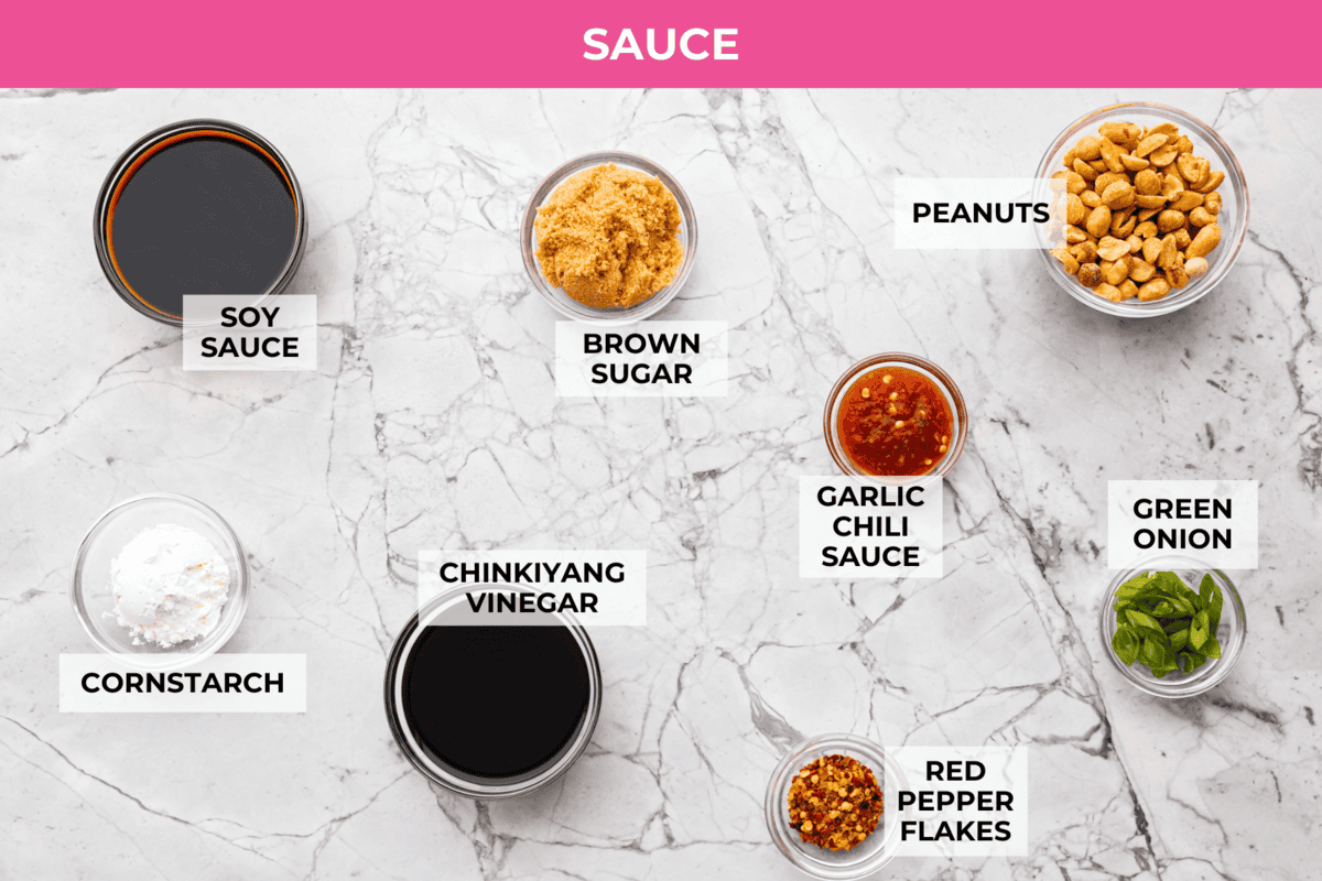 Skip the takeout, these Kung Pao Chicken Noodles are spicy, saucy, and loaded with flavor! Tender chicken, chewy noodles, crunchy peanuts, and a kick of heat all come together in one quick and easy dish that’s perfect for weeknight dinners. Overhead shot of the labeled Kung Pao chicken noodles sauce ingredients.