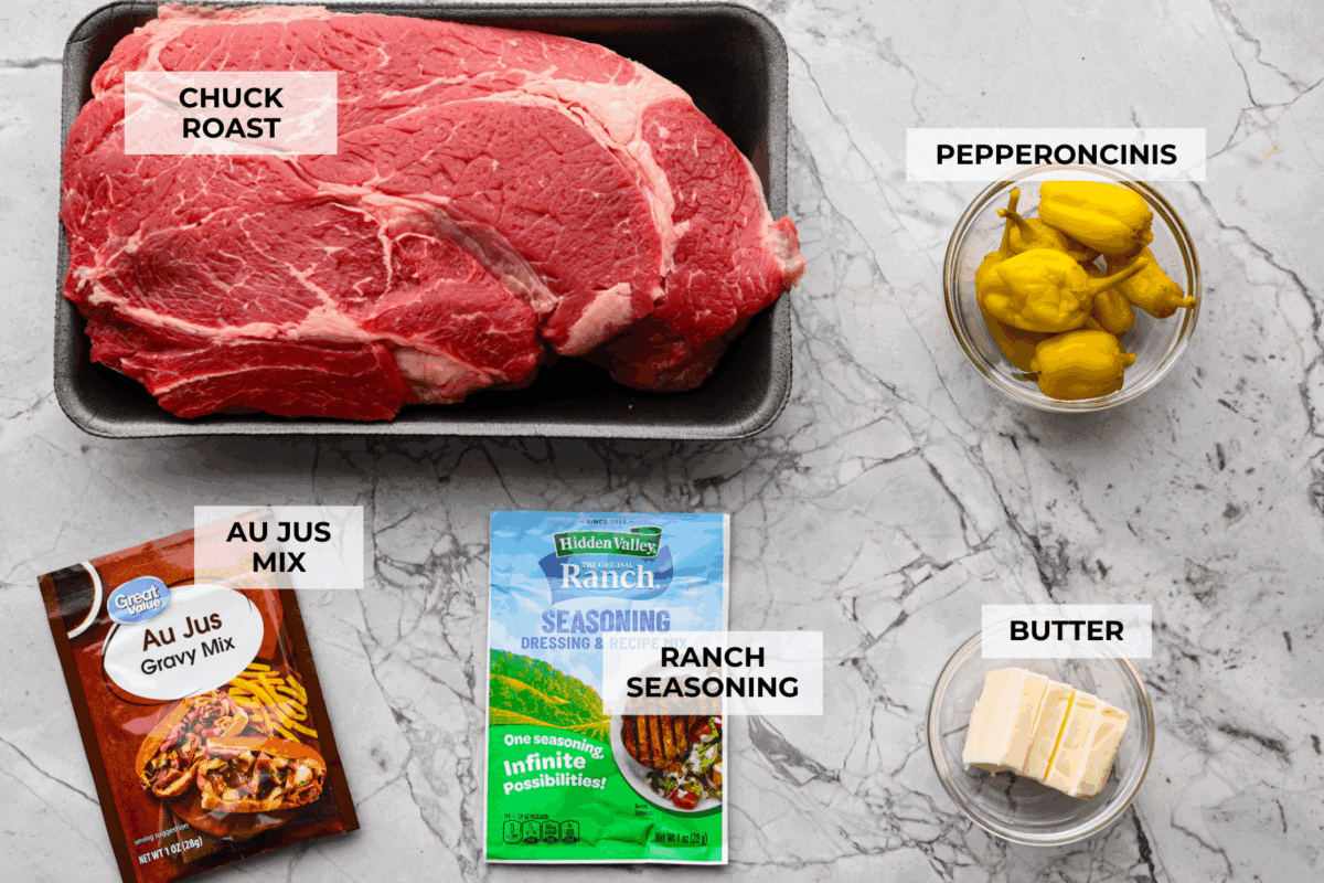 This Mississippi pot roast is melt-in-your-mouth tender, full of rich flavor, and couldn’t be easier. Just five ingredients and your slow cooker does all the work! It's a Sunday favorite at our house, and I know you'll love it too! Overhead shot of labeled ingredients.