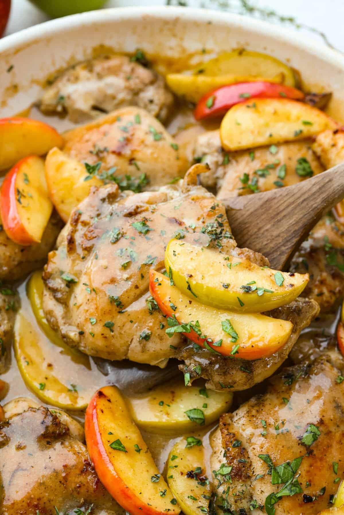 Apple cider chicken thighs bring all the best fall flavors to your plate! Juicy chicken, caramelized apples, and a rich cider sauce for the ultimate cozy dinner. Close up shot of the apple cider chicken thighs.