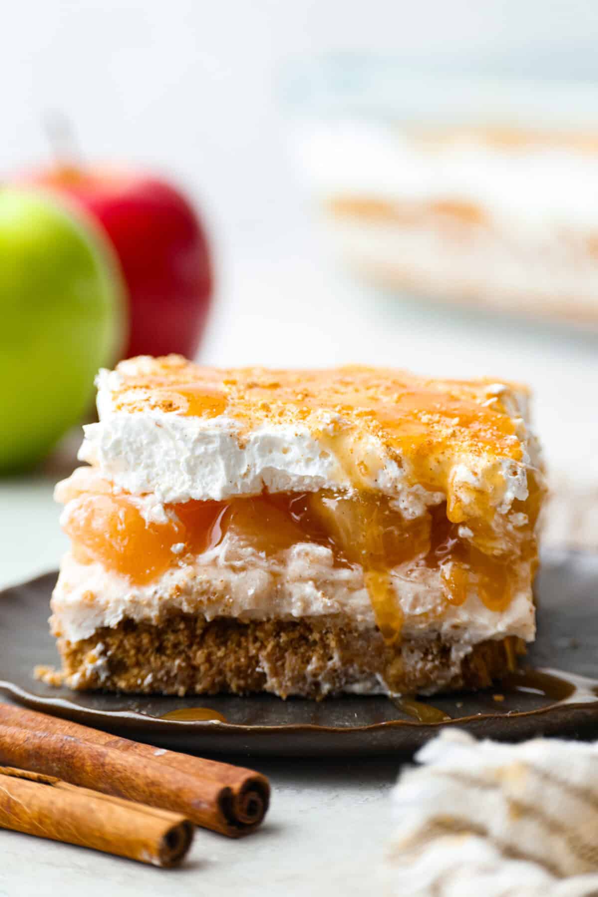Side shot of a piece of caramel apple pie lush. 