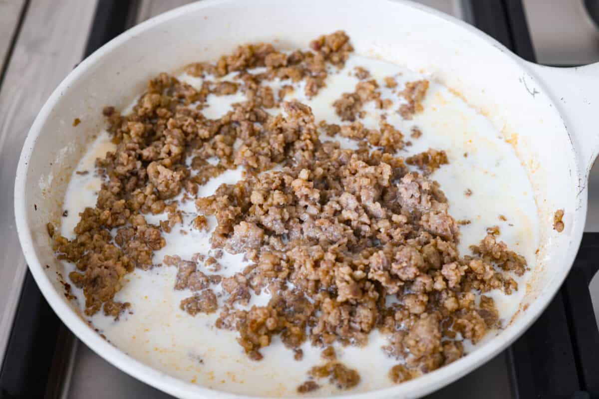 Milk and cream added to the sausage and flour mixture.