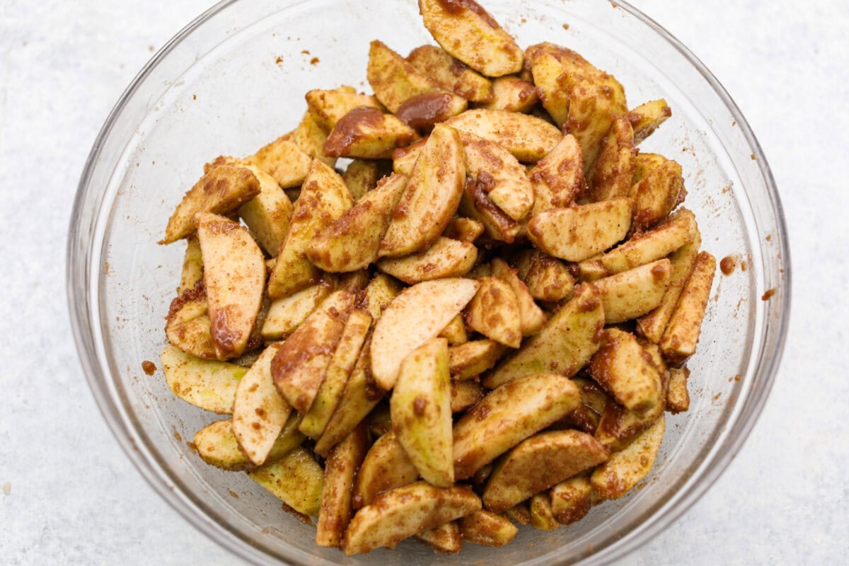 Sugar mixture and apples mixed together to make the brown bag apple pie filling. 