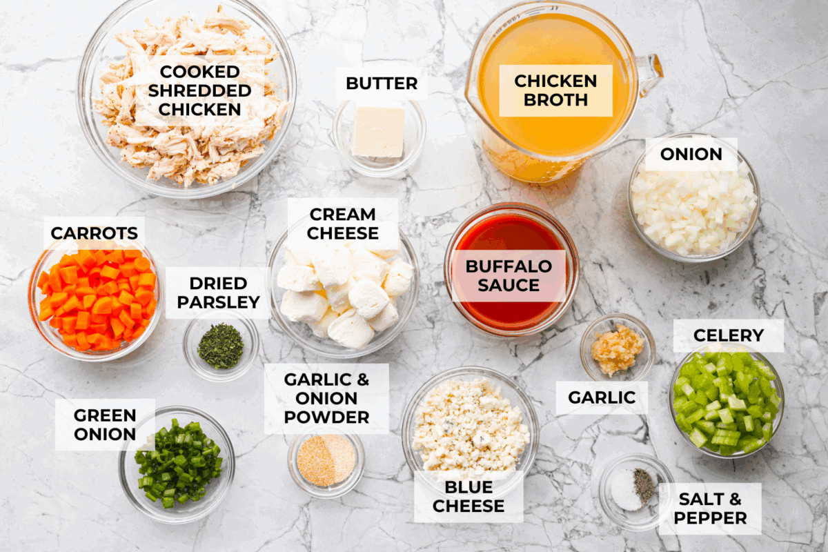 This buffalo chicken soup is about to be your new favorite! It’s creamy, spicy, and loaded with tender chicken and bold flavor, all ready in just 30 minutes. Perfect for busy weeknights, game day, or when you need a cozy meal with a little kick. Overhead shot of labeled ingredients.