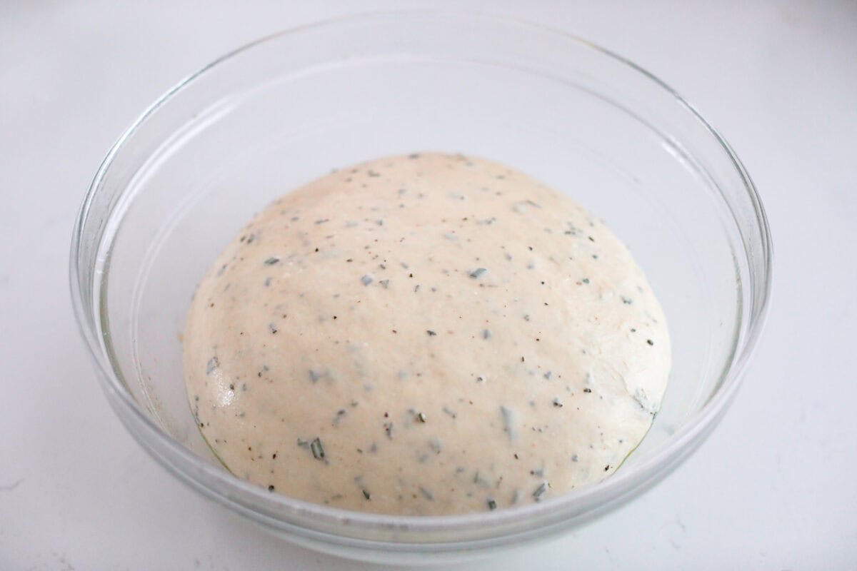 Dough ball added to an oiled mixing bowl to let rise. 