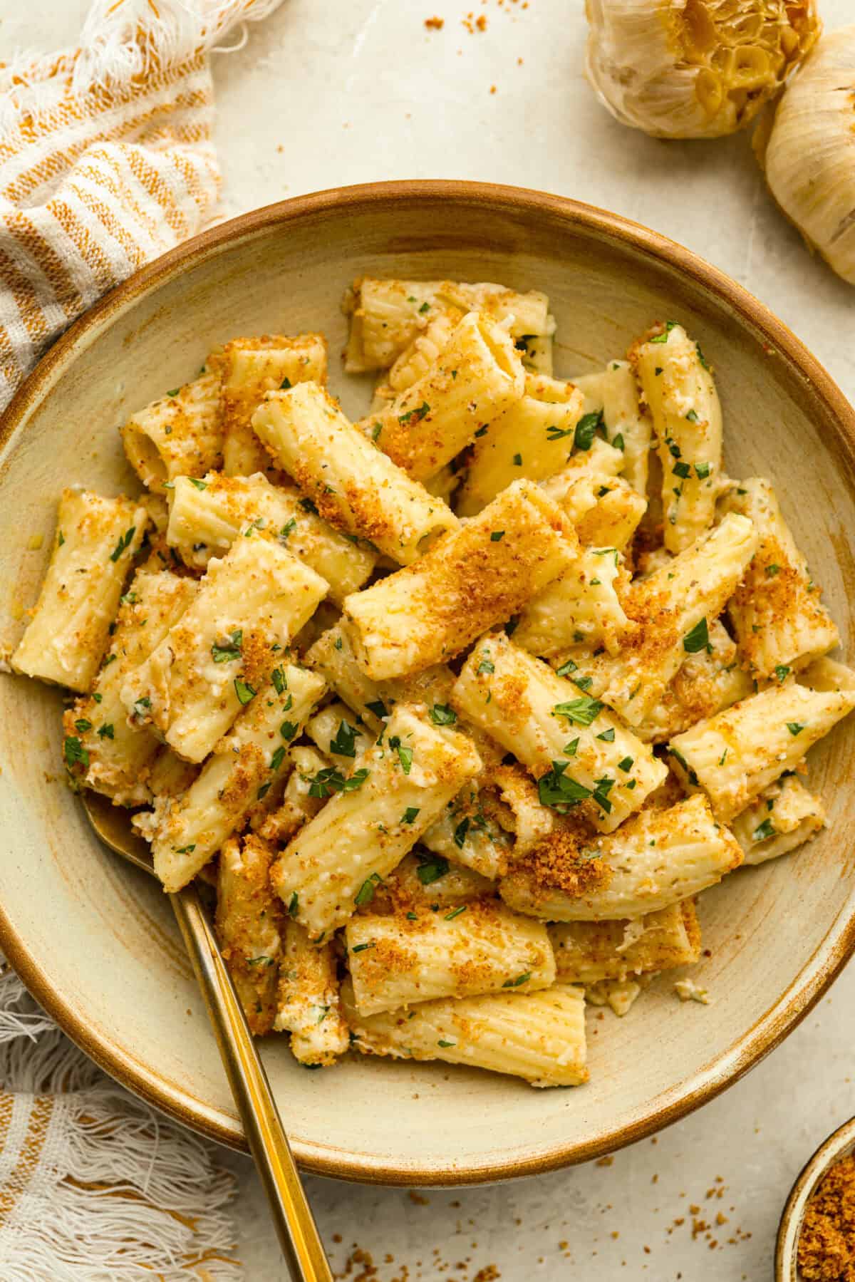 Every time I make garlic bread, my family eats every last piece! This garlic bread pasta has all the same buttery, garlicky flavor you love, just in pasta form. It’s creamy, comforting, and easy to make! And there is plenty to go around! Bowl of a serving size of garlic bread pasta.