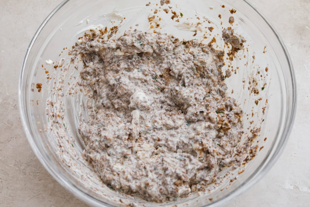 Trust me, this Stuffed Mushroom Dip is way easier (and honestly better) than making stuffed mushrooms. You skip all the filling and baking but still get that creamy, cheesy, herby, sausage flavor everyone’s obsessed with. Mushroom and sausage mixture added to the cream cheese mixture.