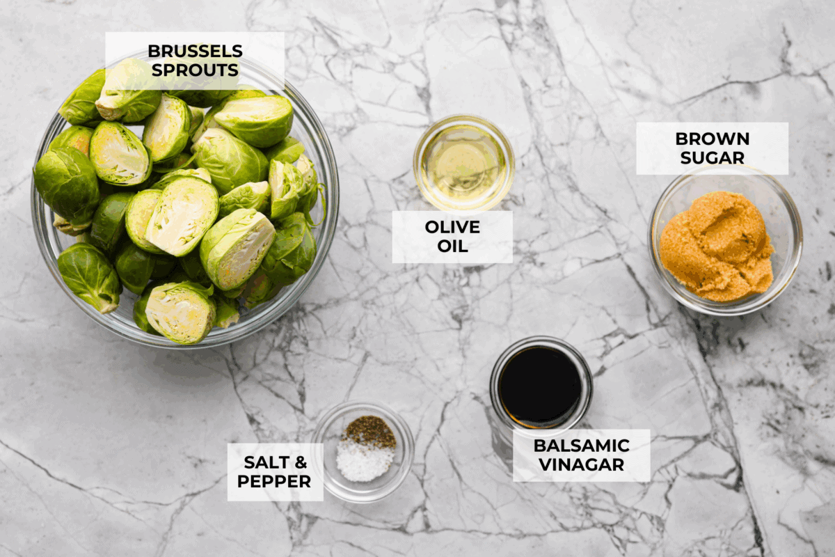 If you don’t normally love Brussels sprouts, this version might surprise you. The air fryer makes these brown sugar Brussels sprouts crisp, done in minutes, and the brown sugar caramelizes them perfectly! Overhead shot of labeled brown sugar Brussels sprouts ingredients.