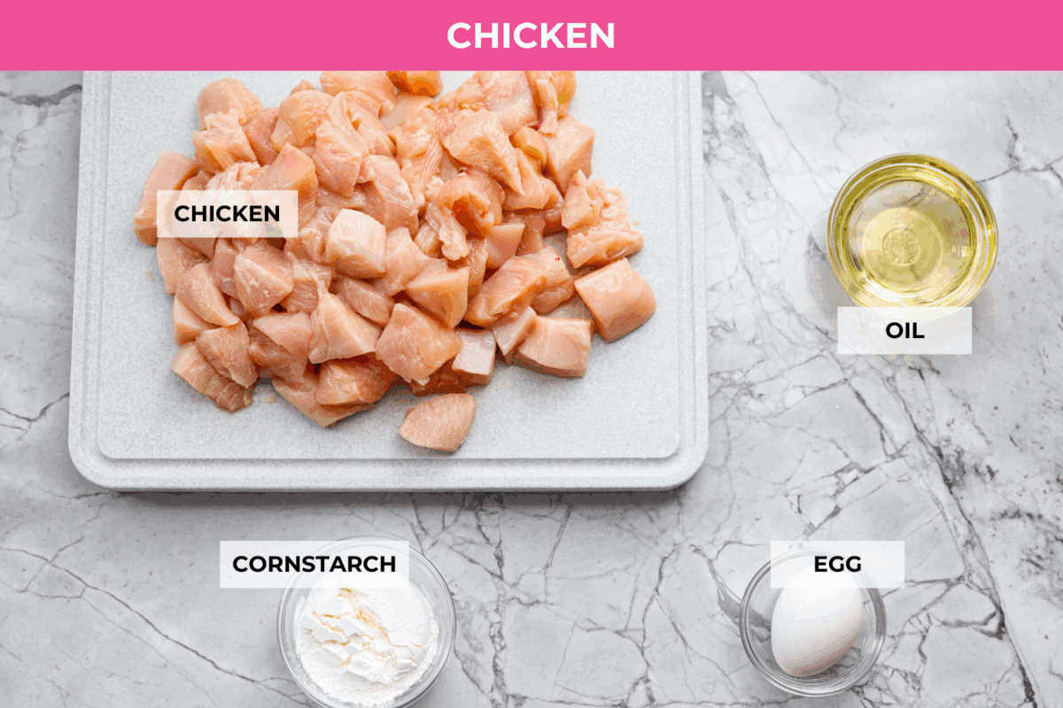 Skip the takeout and make this easy baked General Tso’s chicken at home! It’s crispy, saucy, and perfectly sweet with just the right amount of heat, no deep fryer required. Overhead shot of labeled ingredients.