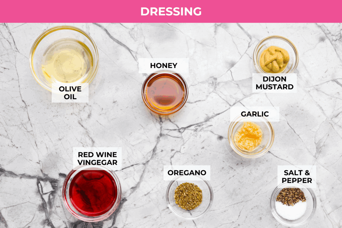 TikTok creator Violet Witchel made this dense bean salad go viral for good reason. It’s simple, high in fiber, protein-packed, and stays delicious for days. My version keeps the same hearty texture and zesty flavor that made her trend explode. Overhead shot of labeled dressing ingredients.