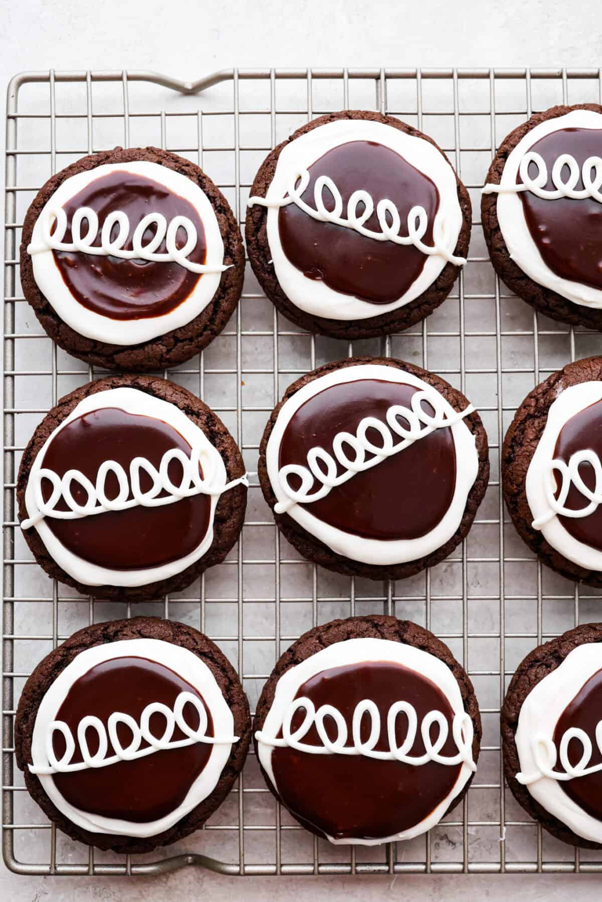 Overhead shot of Hostess Cupcake cookies completed and spread out on a cooling rack. 