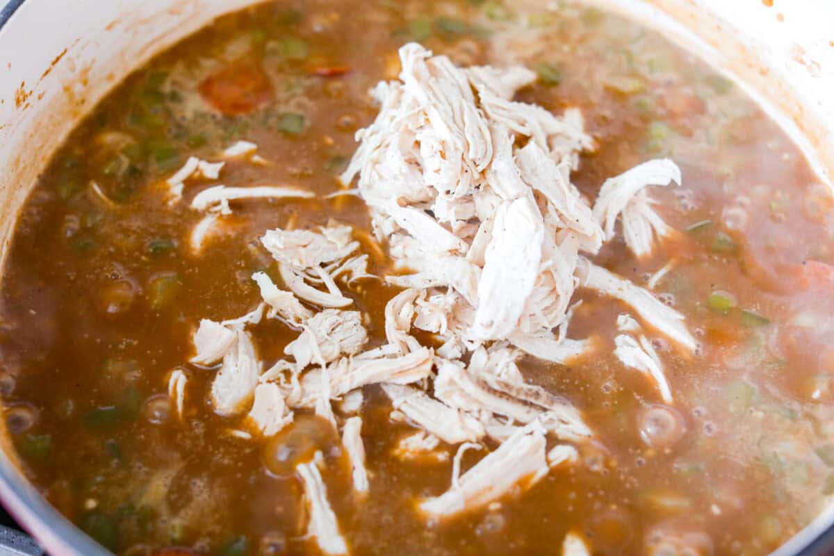 After listening to your feedback and learning what makes a great New Orleans gumbo, I made some changes. This version is richer, more balanced, and way closer to the real deal, without being overwhelming to make at home. Shredded chicken added to the pot.