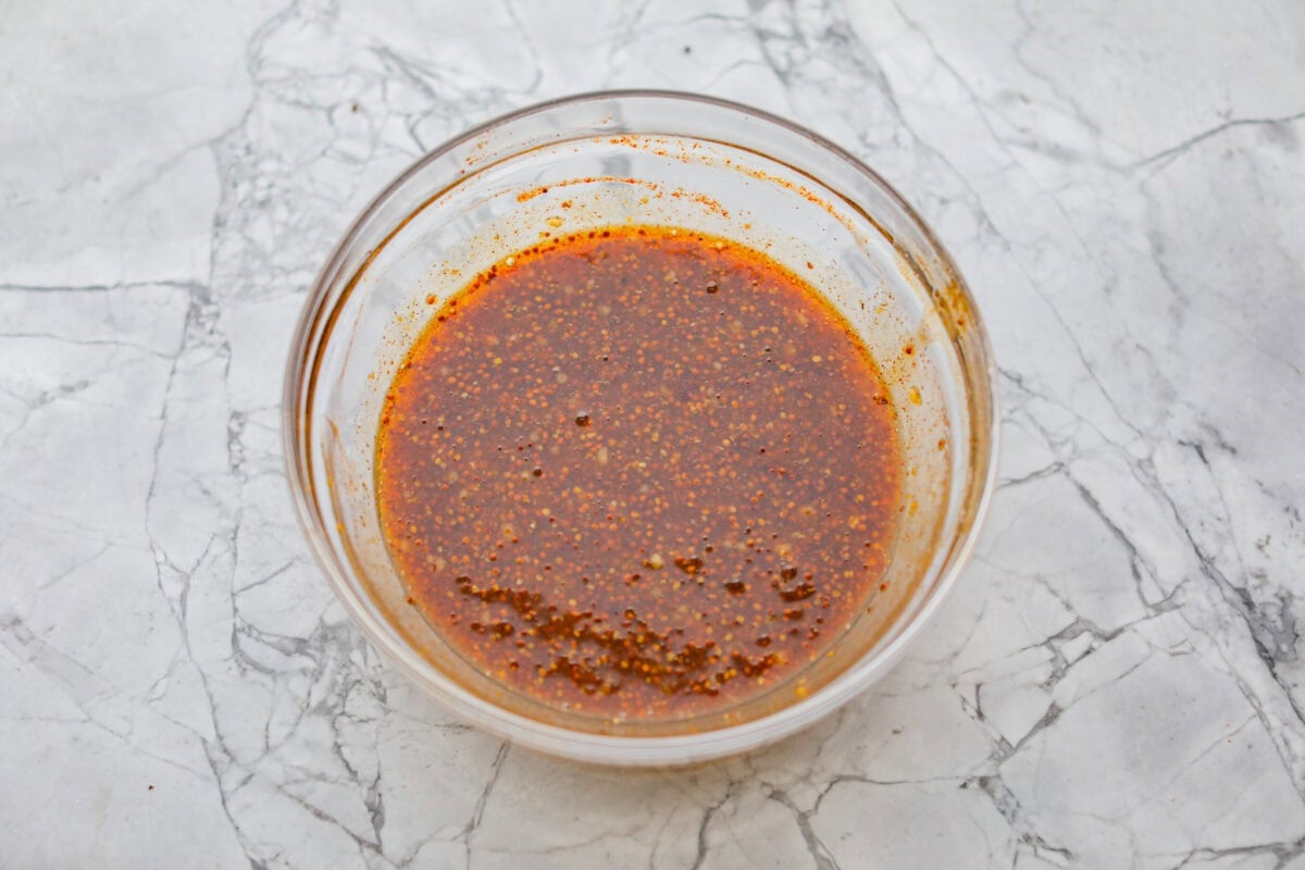 These honey mustard pork chops bring big flavor with very little effort. The whole grain mustard adds texture and bite, while a few extra spices deepen the sauce, turning a simple skillet dinner into something totally crave-worthy. Honey mustard sauce ingredients all mixed together in a bowl.