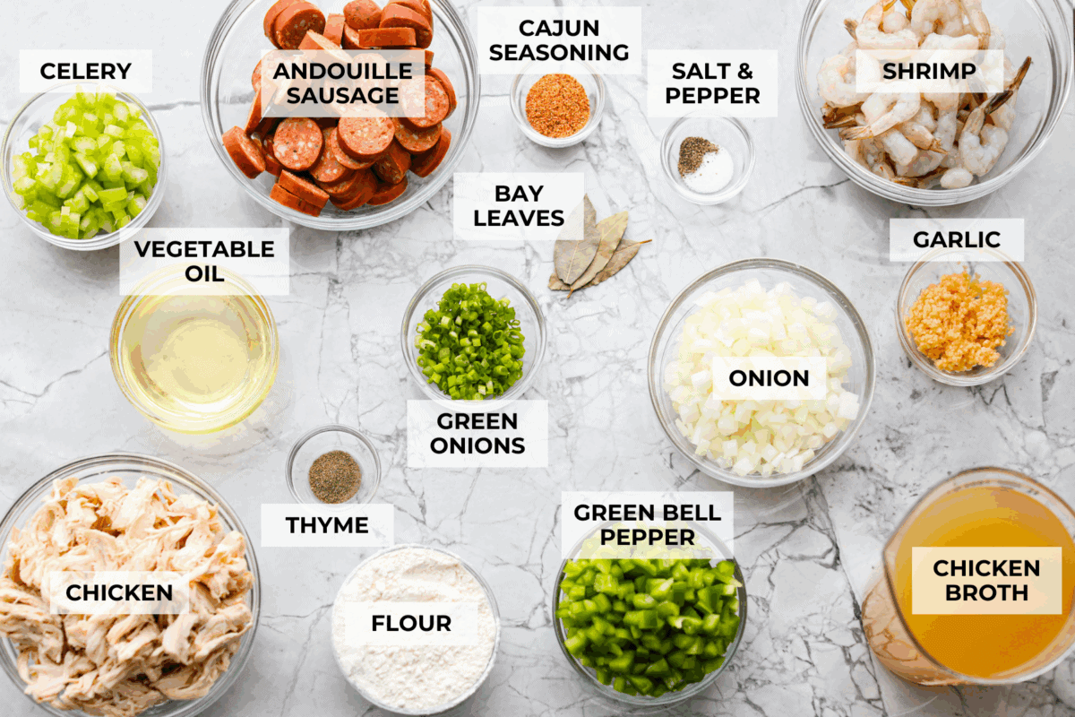 After listening to your feedback and learning what makes a great New Orleans gumbo, I made some changes. This version is richer, more balanced, and way closer to the real deal, without being overwhelming to make at home. Overhead shot of labeled New Orleans gumbo ingredients.