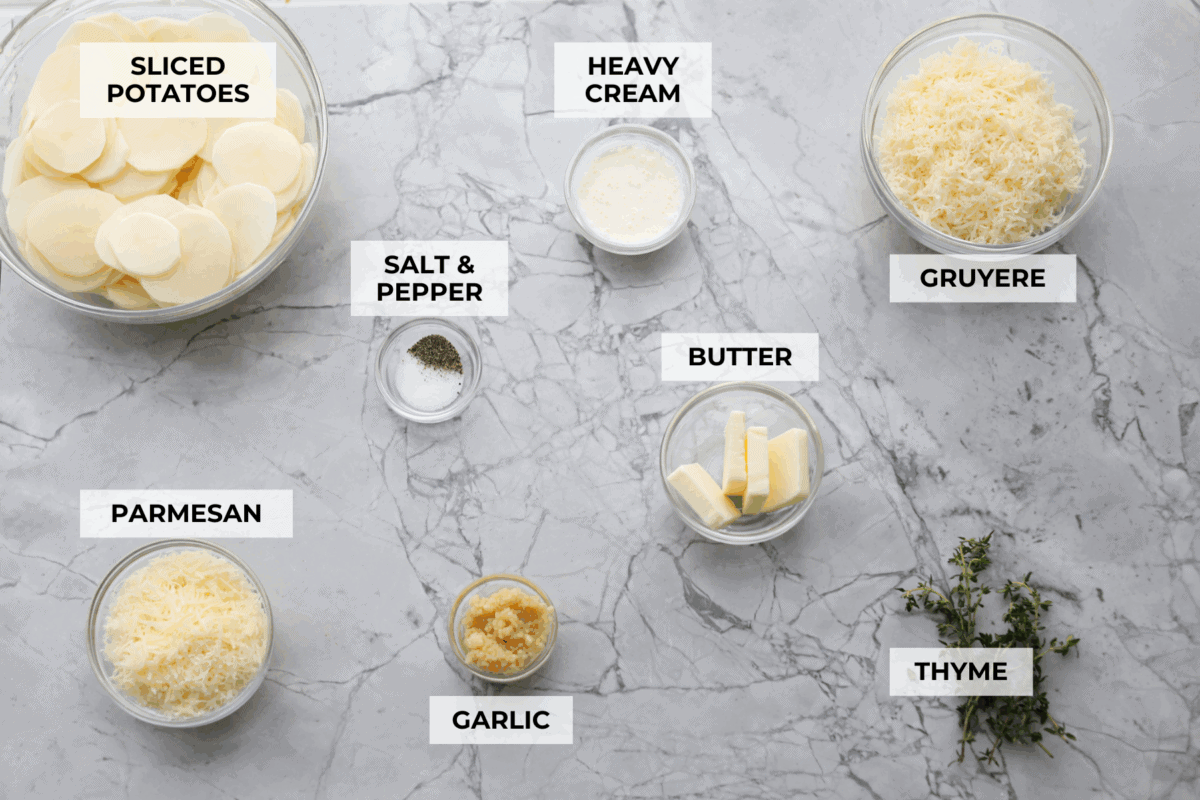 My crispy potato stacks take everything you love about cheesy, golden potatoes and turn it into an easy side dish. Thin slices bake into crisp edges and tender centers, with melty cheese and dripping with seasoned garlic butter! Overhead shot of labeled ingredients.