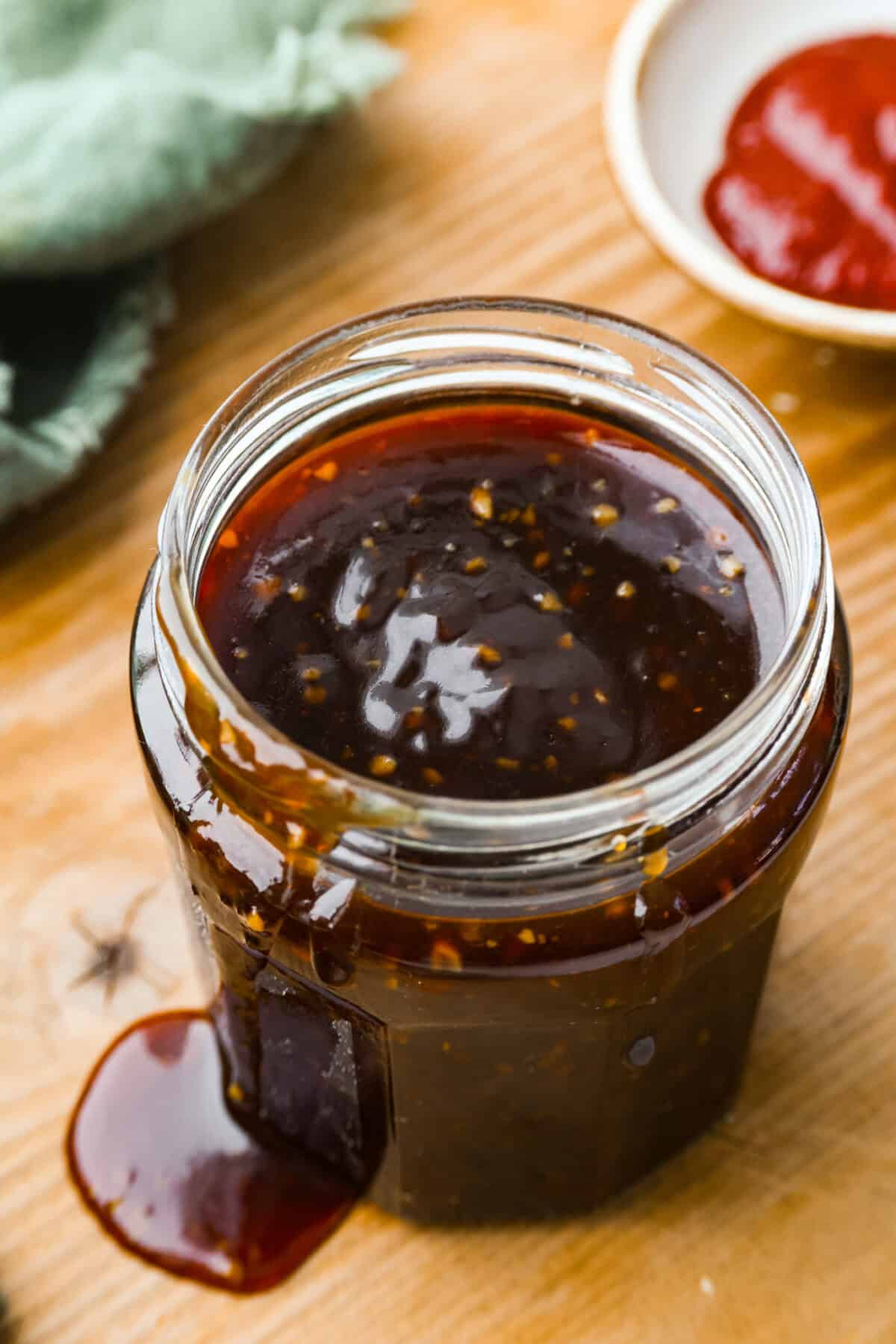 Korean BBQ sauce is the kind of pantry staple that turns random weeknight ingredients into something irresistible. Use it to glaze salmon, coat wings, toss with chicken and veggies, or turn into a killer Korean BBQ pizza Overhead shot of the jar of Korean BBQ sauce.