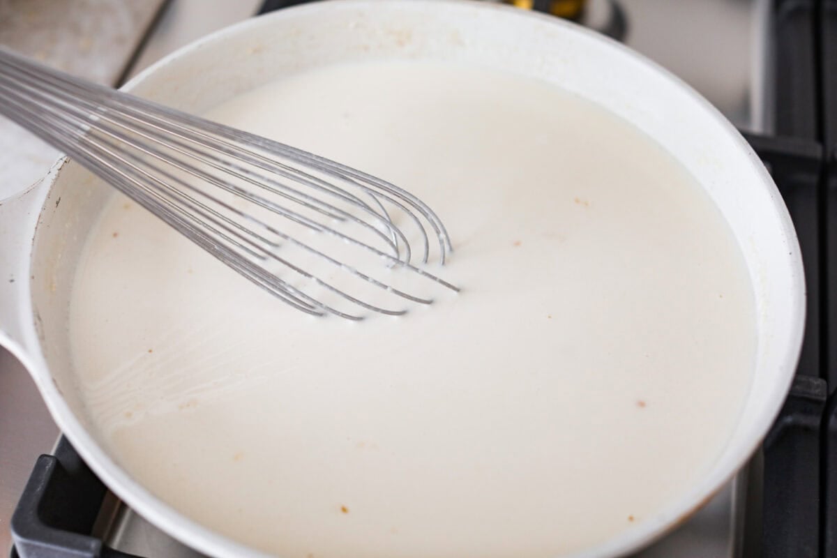 Chicken broth, cream and parmesan cheese added to the butter and flour mixture.