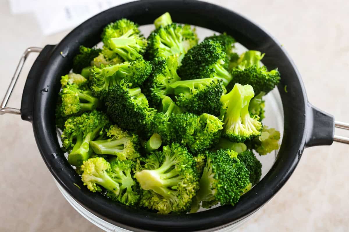 Chicken Divan is what I make when I want comfort food that still feels a little put-together. You get tender chicken, crisp-tender broccoli, and a creamy sauce bubbling under the most delicious golden, crunchy topping! Broccoli being steamed.