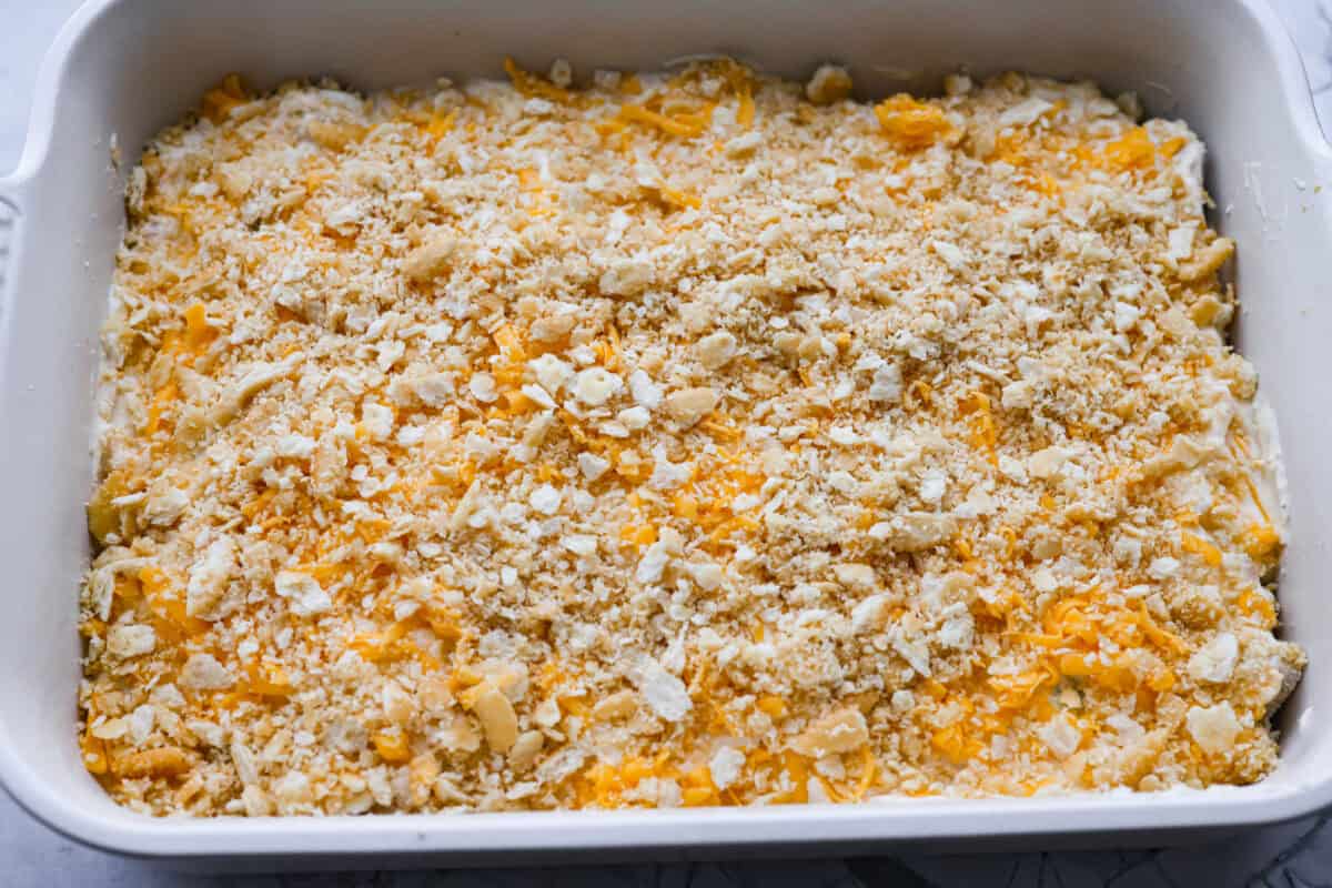 Chicken Divan is what I make when I want comfort food that still feels a little put-together. You get tender chicken, crisp-tender broccoli, and a creamy sauce bubbling under the most delicious golden, crunchy topping! Ritz cracker crumbs spread over the top of the casserole, ready to be baked.