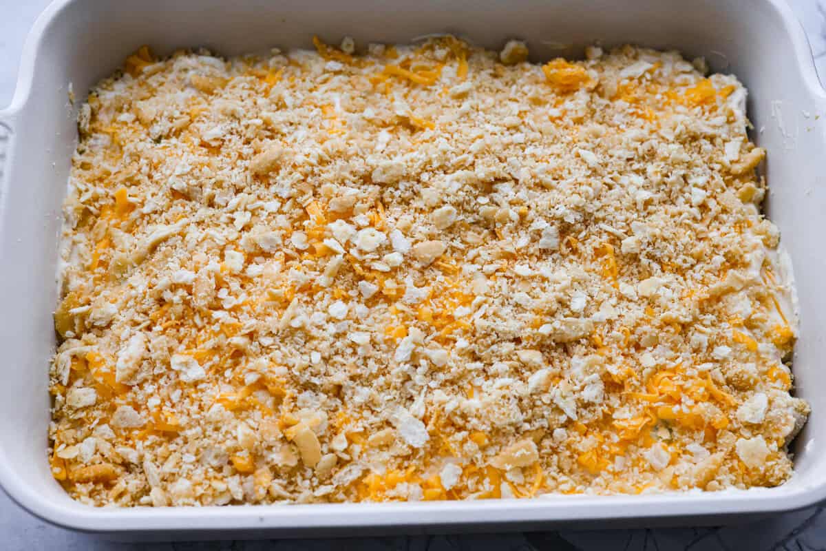 Chicken Divan is what I make when I want comfort food that still feels a little put-together. You get tender chicken, crisp-tender broccoli, and a creamy sauce bubbling under the most delicious golden, crunchy topping! Ritz cracker crumbs spread over the top of the casserole, ready to be baked.