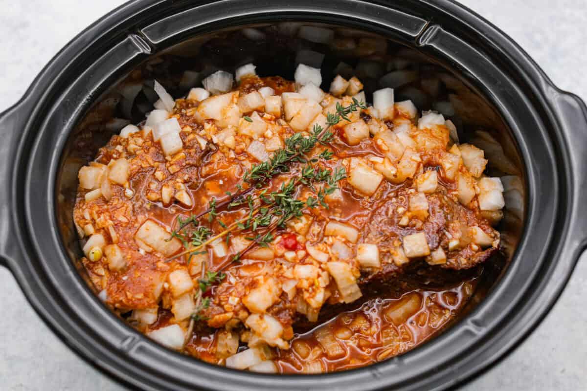 This horseradish pot roast is pure comfort food with a flavorful twist. The beef cooks low and slow until fork-tender, soaking up a rich, savory sauce with just enough horseradish to add depth without being overwhelming. Sauce and sage added to the slow cooker with the roast and onions.