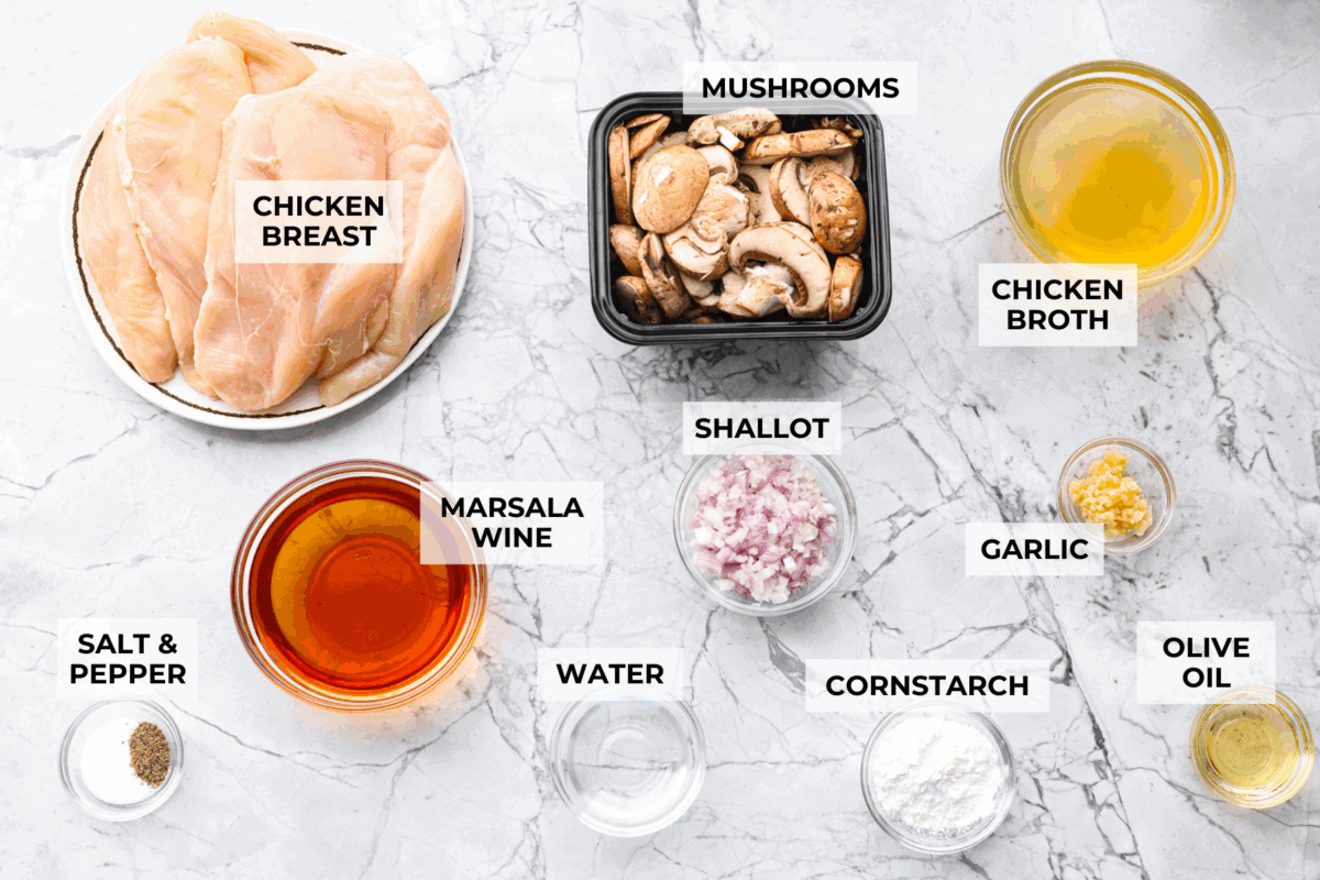 Overhead shot of labeled crockpot chicken marsala ingredients. 