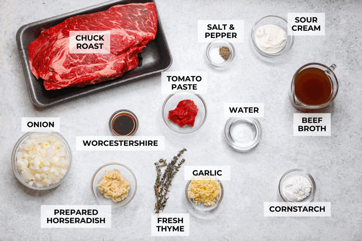 This horseradish pot roast is pure comfort food with a flavorful twist. The beef cooks low and slow until fork-tender, soaking up a rich, savory sauce with just enough horseradish to add depth without being overwhelming. Overhead shot of labeled horseradish pot roast ingredients.