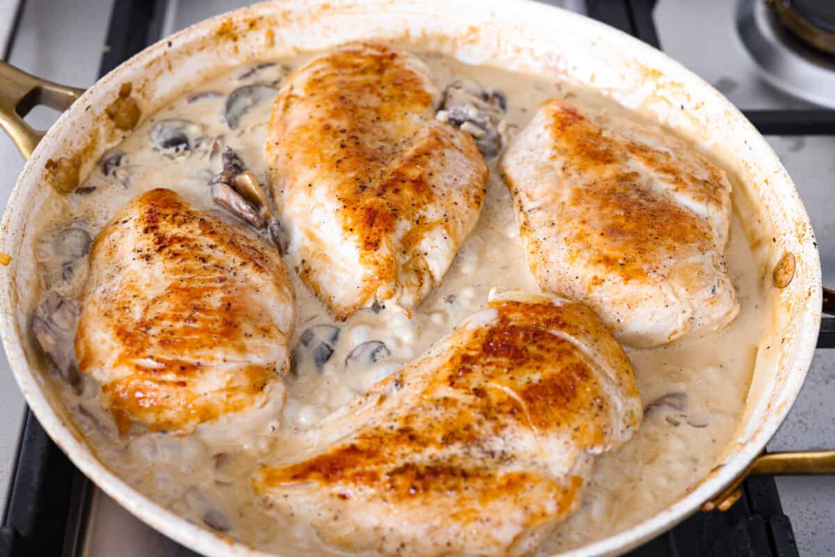 This chicken Diane takes everything you love about steak Diane and turns it into an easy chicken dinner. One skillet, a rich creamy mushroom sauce, and tons of flavor in every bite! Cooked chicken added back to the skillet.