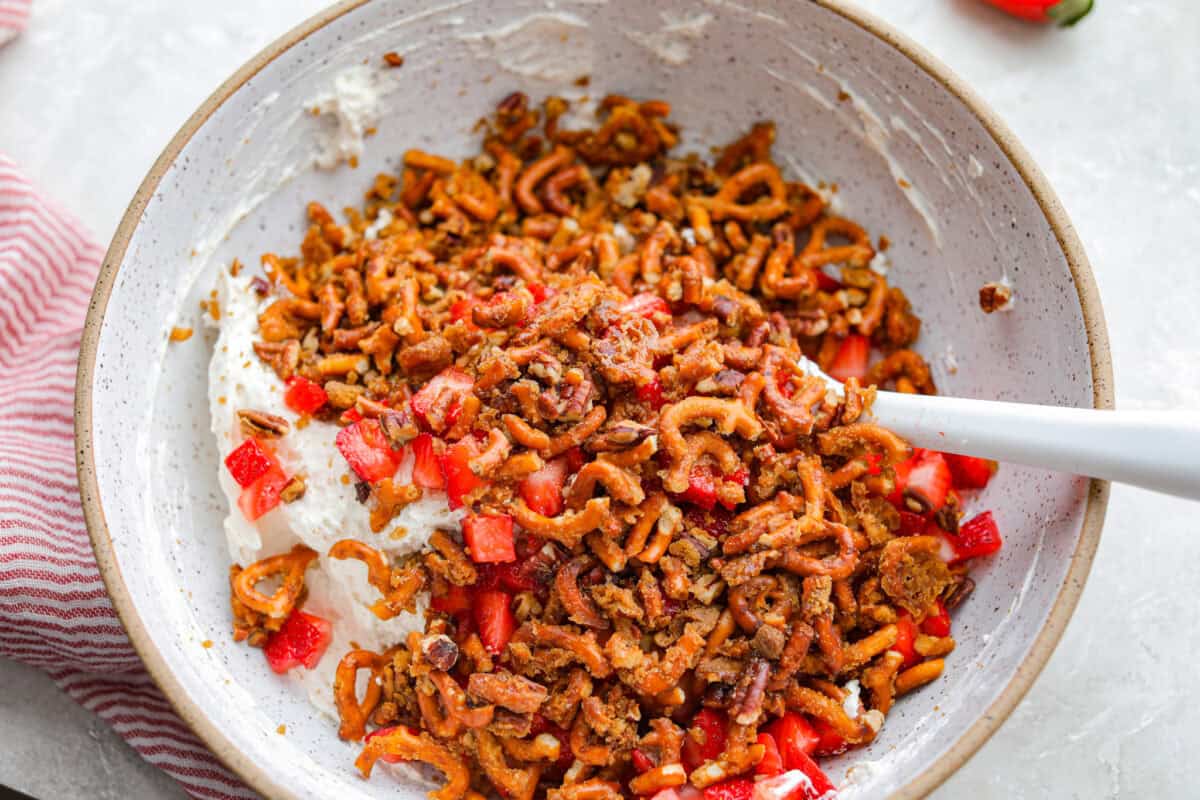 Stir all strawberry pieces, pretzel mixture, and cream cheese mixture together in a bowl. 