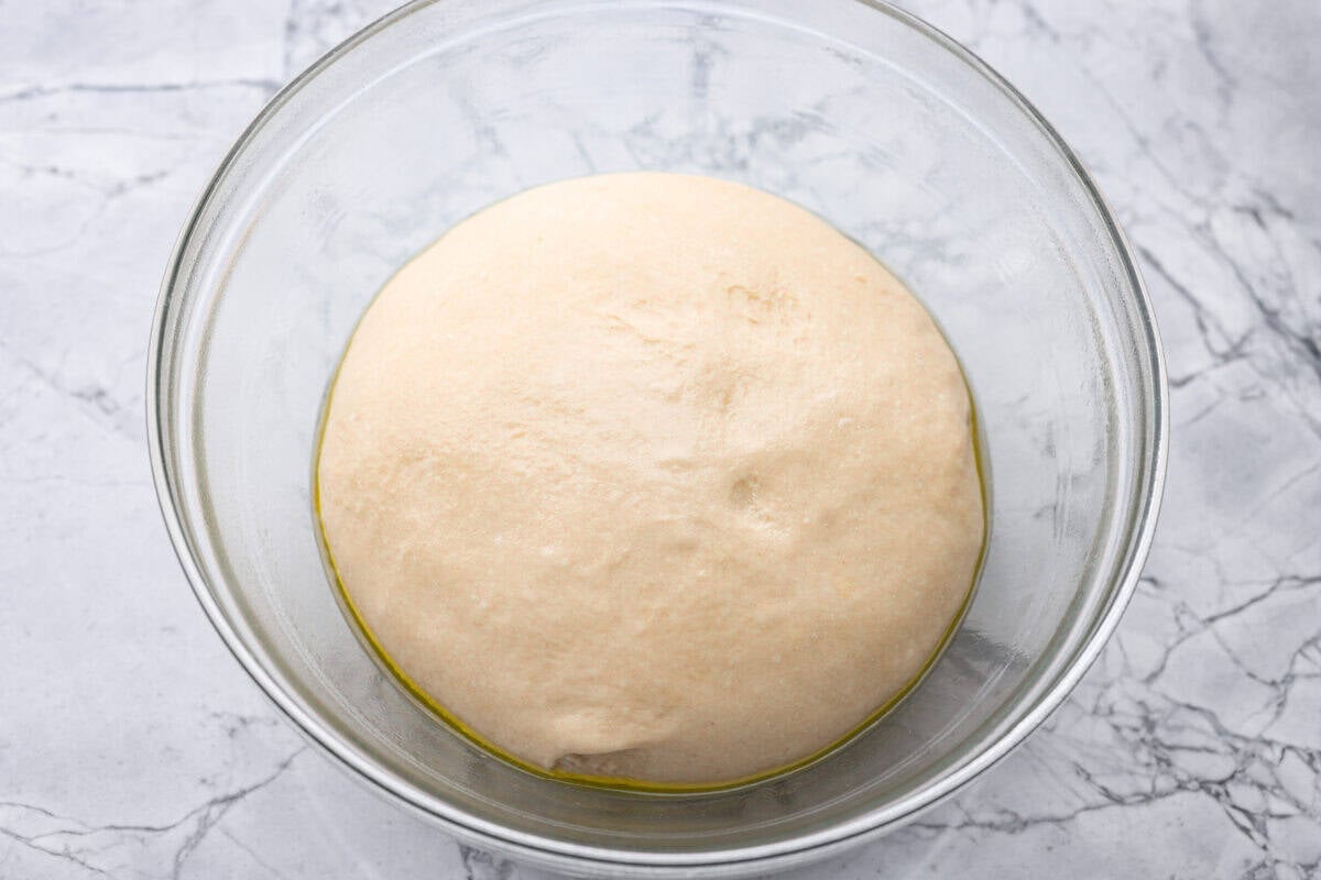 If warm, homemade bread is your weakness, you’re going to love these French bread rolls. They’re soft, chewy, and perfect for everything from weeknight dinners to holiday meals. Dough ball in the bottom of a bowl rising.