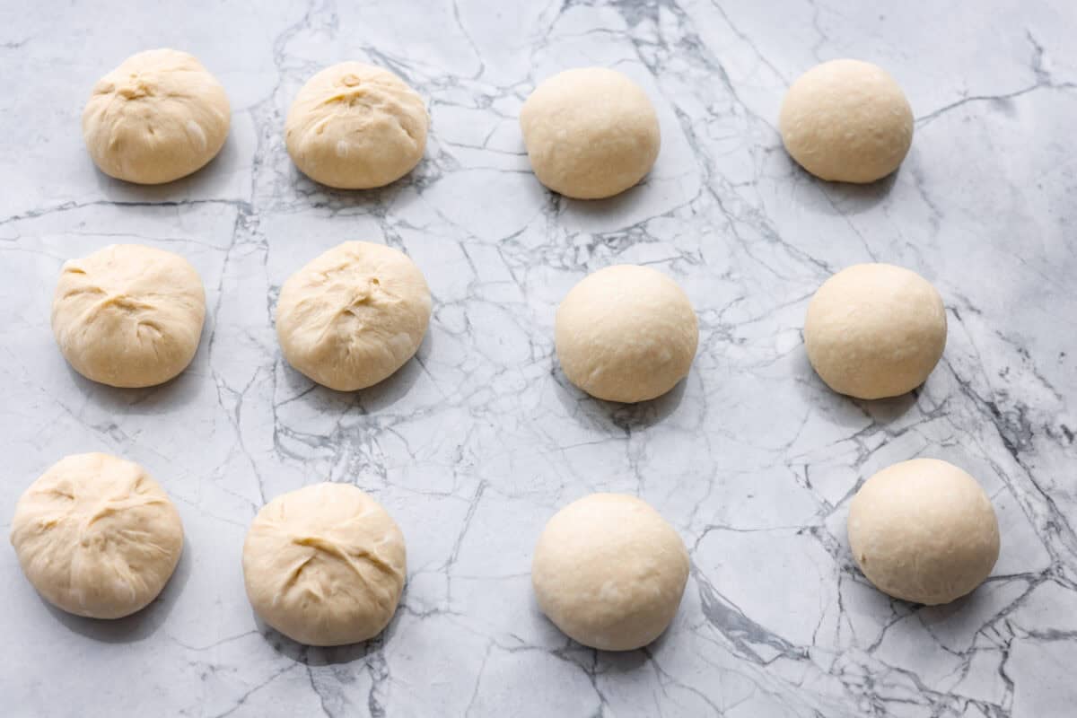 If warm, homemade bread is your weakness, you’re going to love these French bread rolls. They’re soft, chewy, and perfect for everything from weeknight dinners to holiday meals. Dough sections rolled into balls.