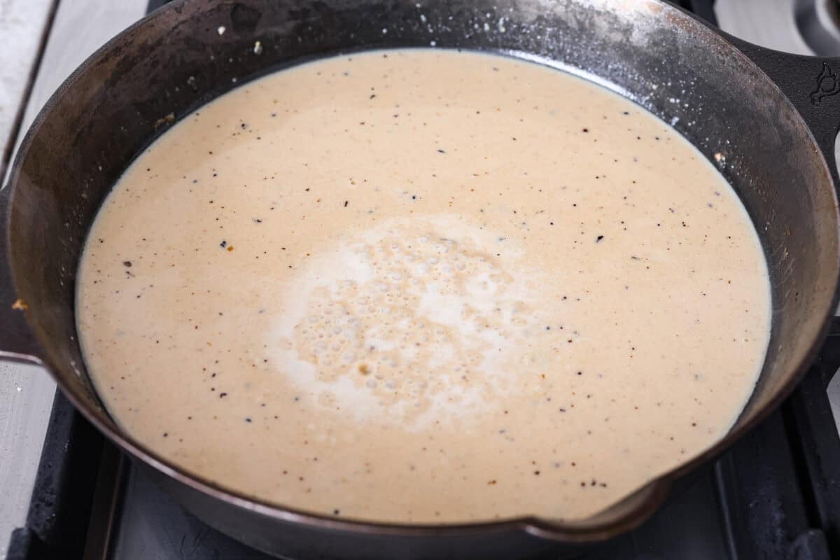 This lemon butter chicken is about to become your new weeknight secret weapon. One skillet, simple ingredients, and less than 30 minutes to the most golden, saucy, creamy chicken you've ever made. Lemon butter chicken sauce in a skillet.