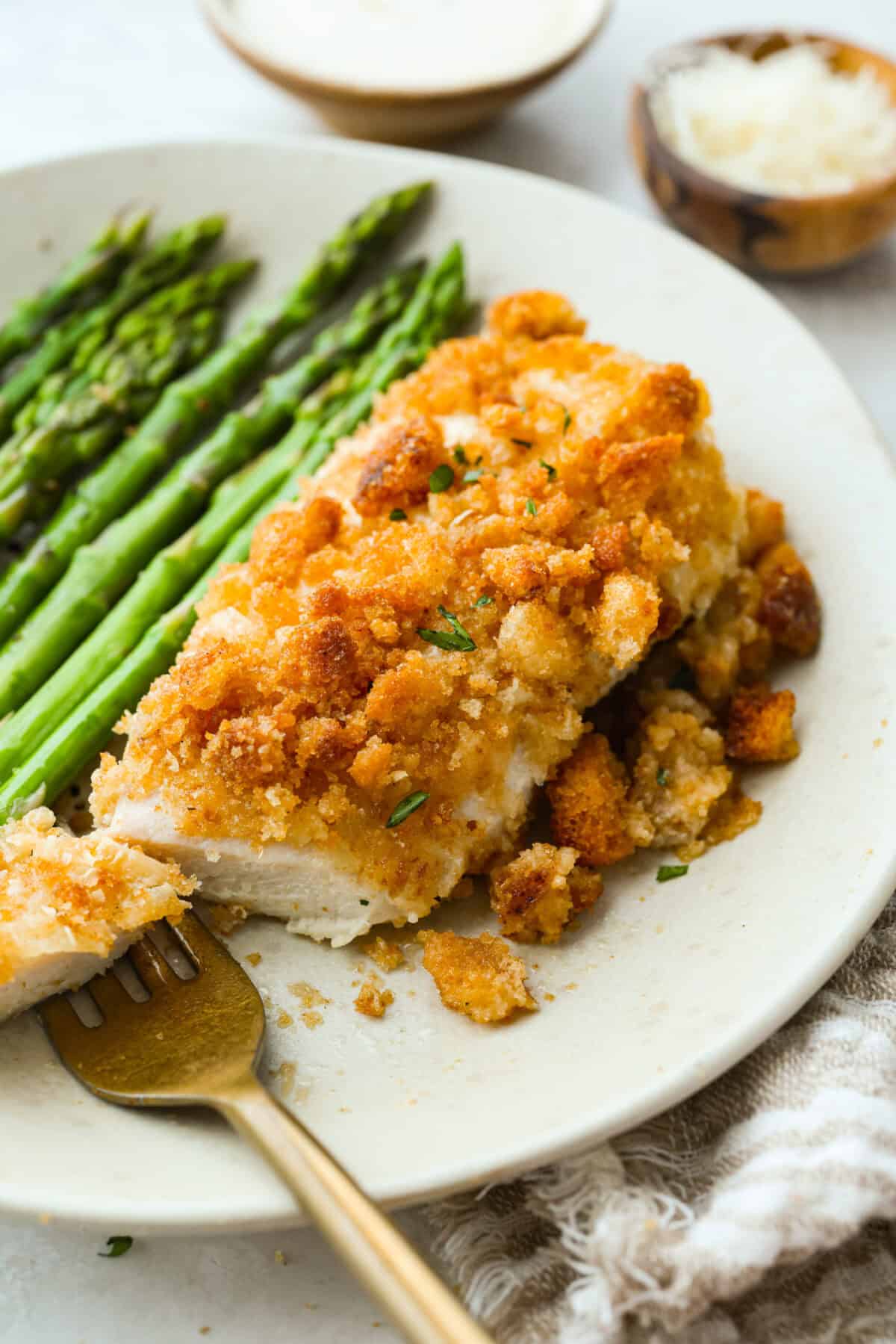 Plated caesar chicken salad bake with asparagus. 
