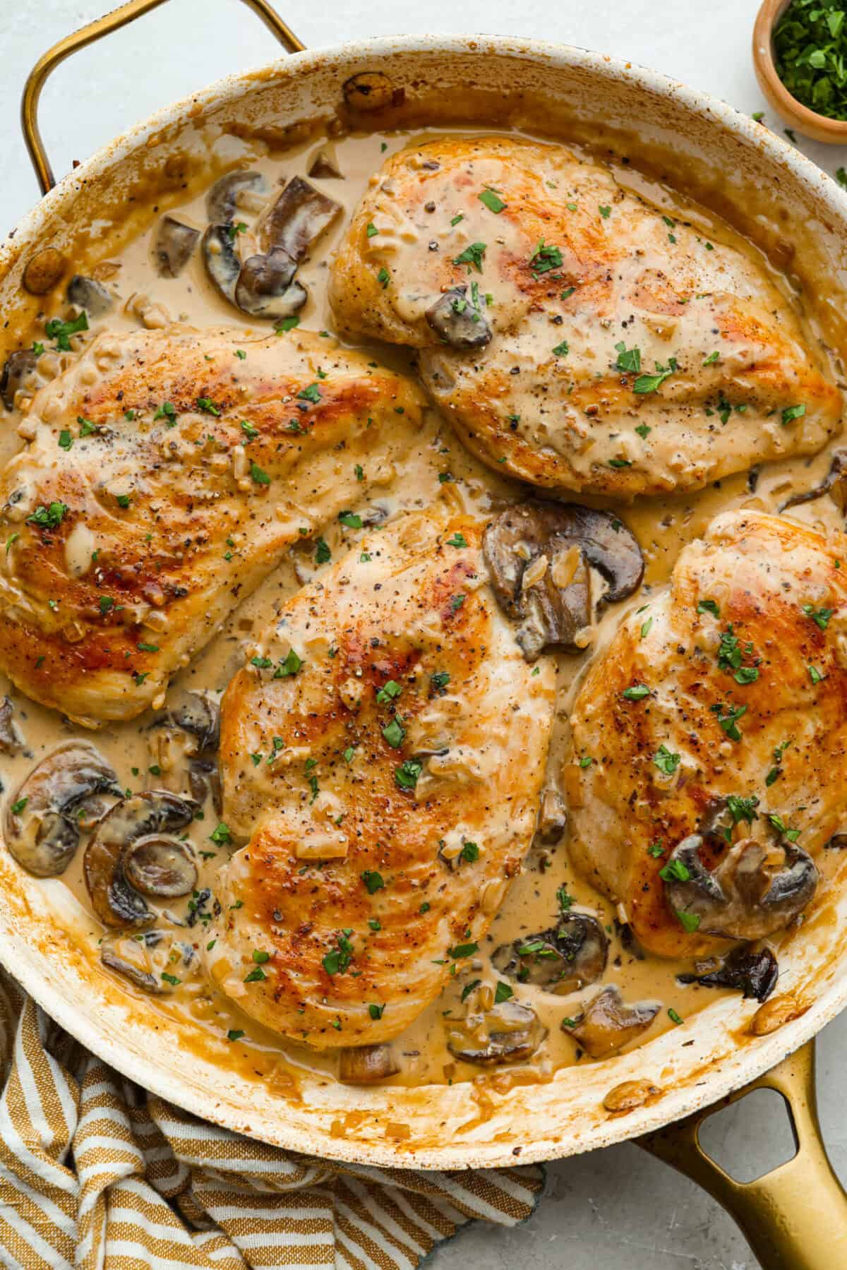 This chicken Diane takes everything you love about steak Diane and turns it into an easy chicken dinner. One skillet, a rich creamy mushroom sauce, and tons of flavor in every bite! Pan of chicken Diane, in a creamy mushroom sauce.