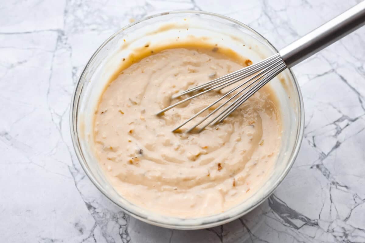 Gravy ingredients whisked together in a bowl. 