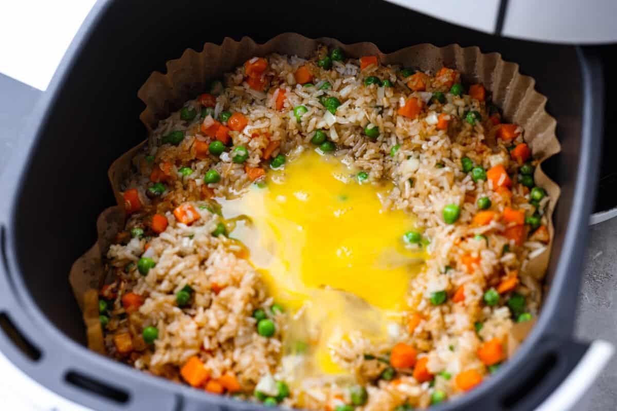 Eggs whisked together and poured on top of the cooked rice mixture. 