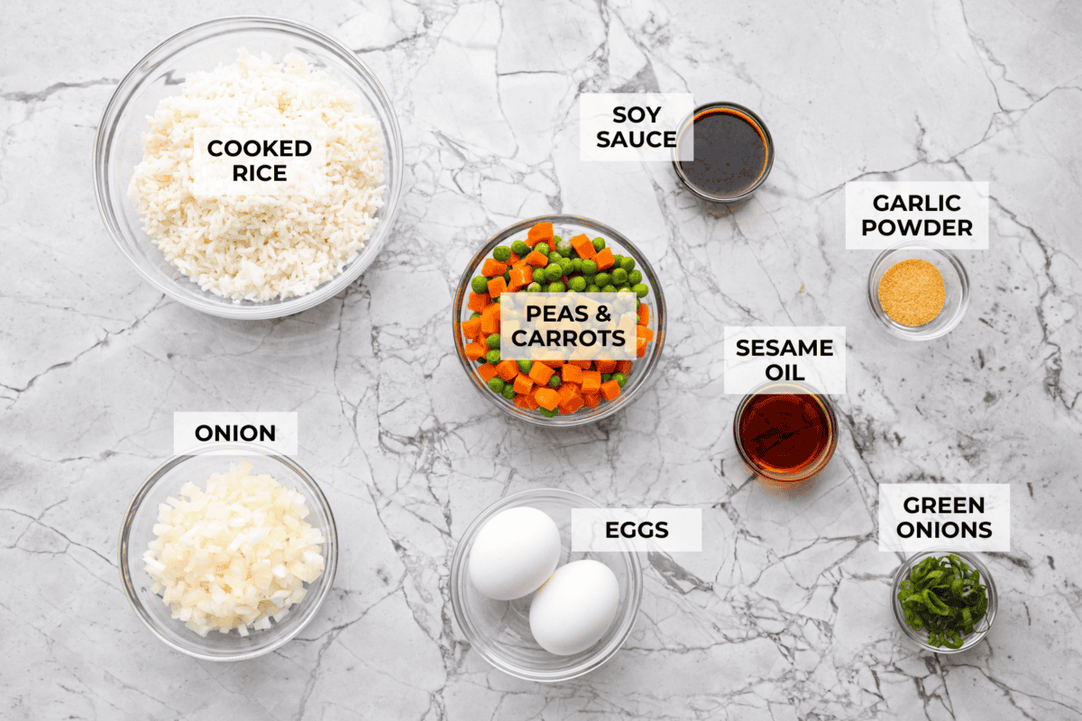 Overhead shot of labeled air fryer fried rice ingredients. 