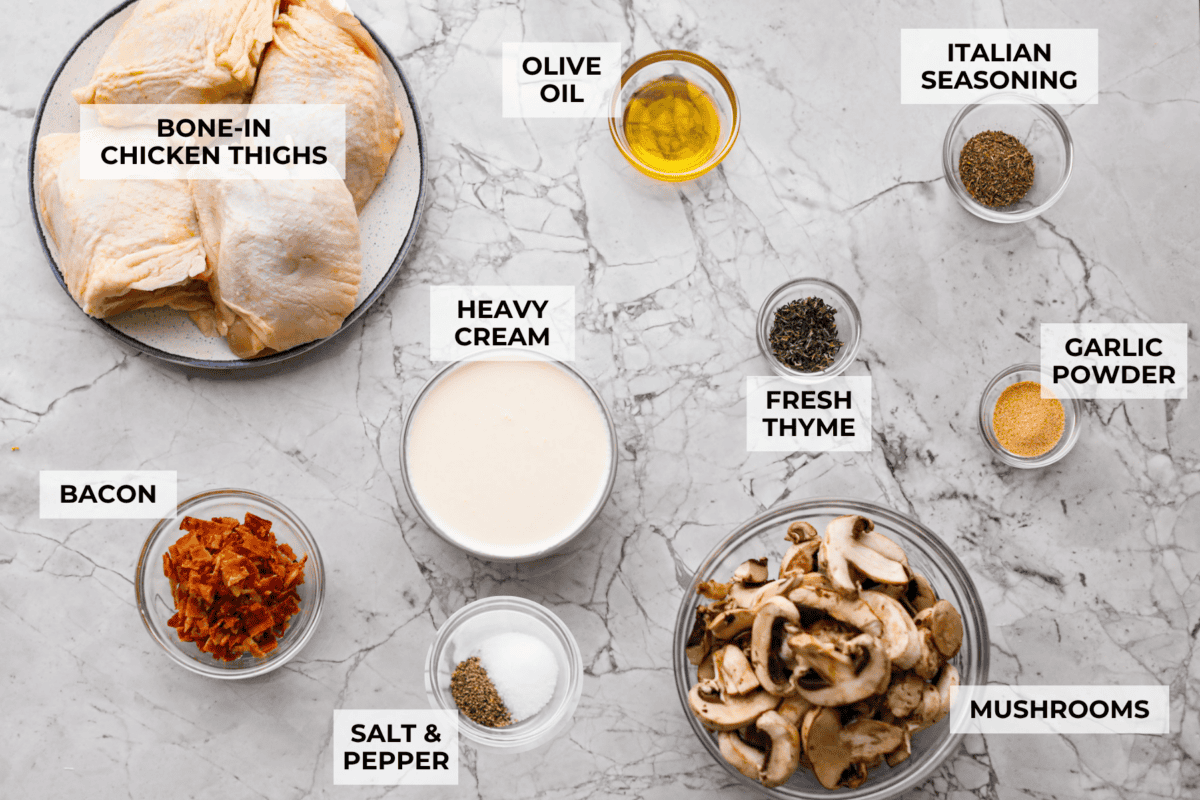 If cozy dinners are your thing, this creamy bacon mushroom thyme chicken needs to happen soon. Between the crispy chicken skin, smoky bacon, and creamy mushroom sauce, every bite tastes rich and savory. Perfect for spooning over mashed potatoes! Overhead shot of labeled ingredients.