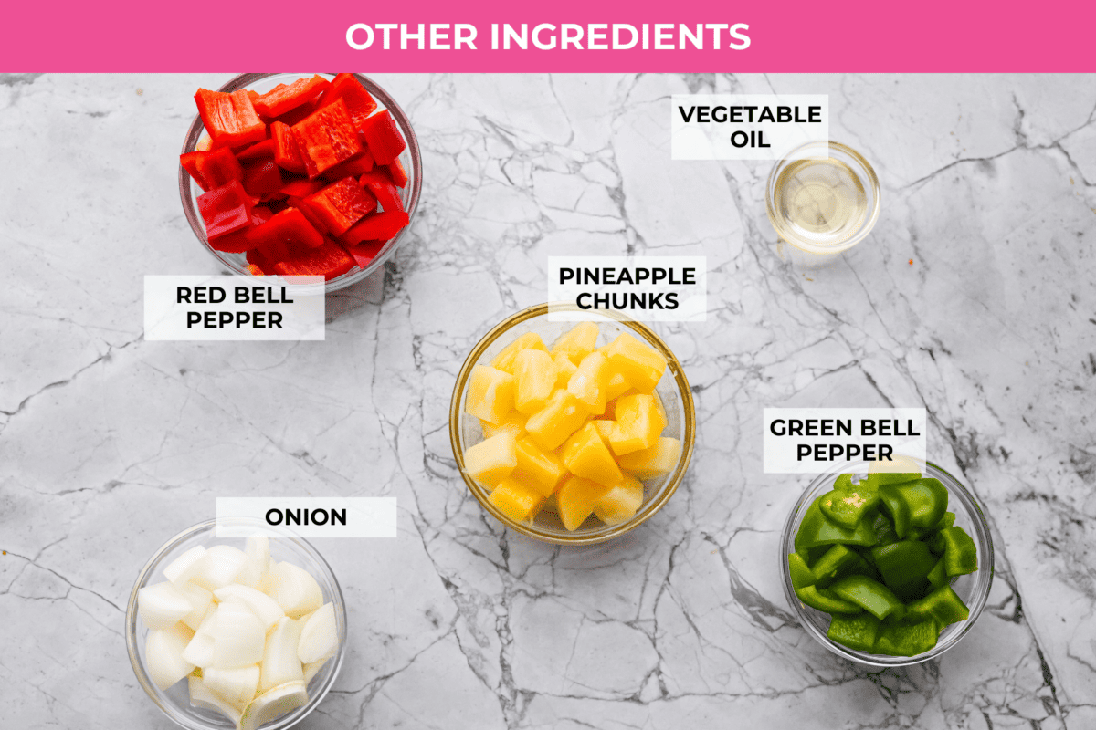 These sweet and sour meatballs are one of those dinners I pull out when I need something easy, but I know everyone likes! They’re saucy, a little sweet, a little tangy, and come together fast. Overhead shot of labeled other ingredients for sweet and sour meatballs.