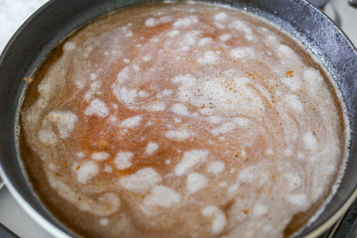 Beef broth added to the garlic and butter. 