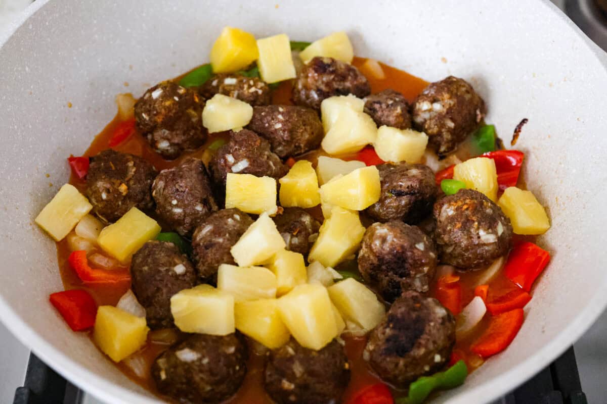 These sweet and sour meatballs are one of those dinners I pull out when I need something easy, but I know everyone likes! They’re saucy, a little sweet, a little tangy, and come together fast. Meatballs, veggies, and pineapple all doused in the sauce and cooking in a skillet.