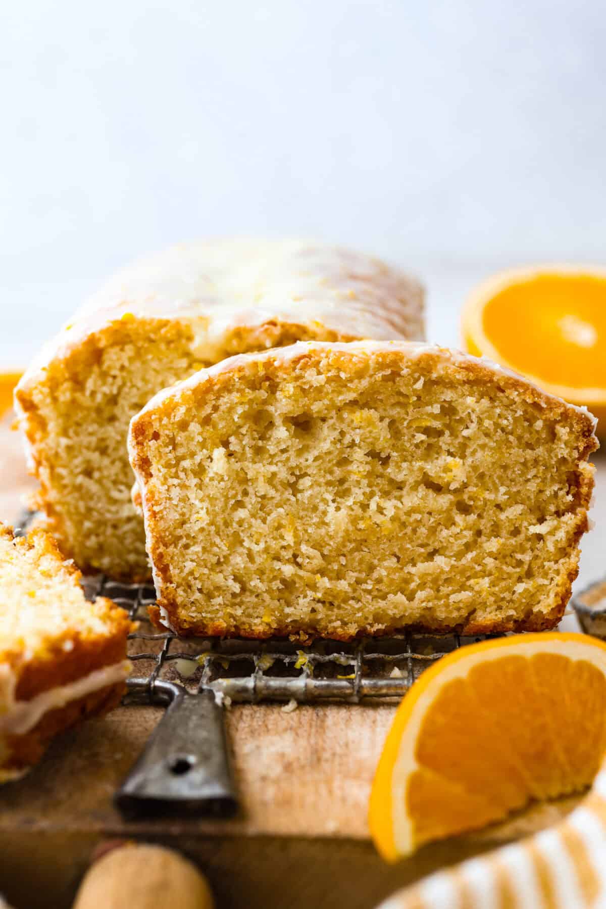 This glazed orange loaf is sunshine in every slice! Fresh orange zest and juice give it a bright citrus flavor. It's just like this incredibly popular Lemon Loaf. It’s the kind of quick bread you keep coming back to for just one more slice. Side shot of my glazed orange loaf sliced.