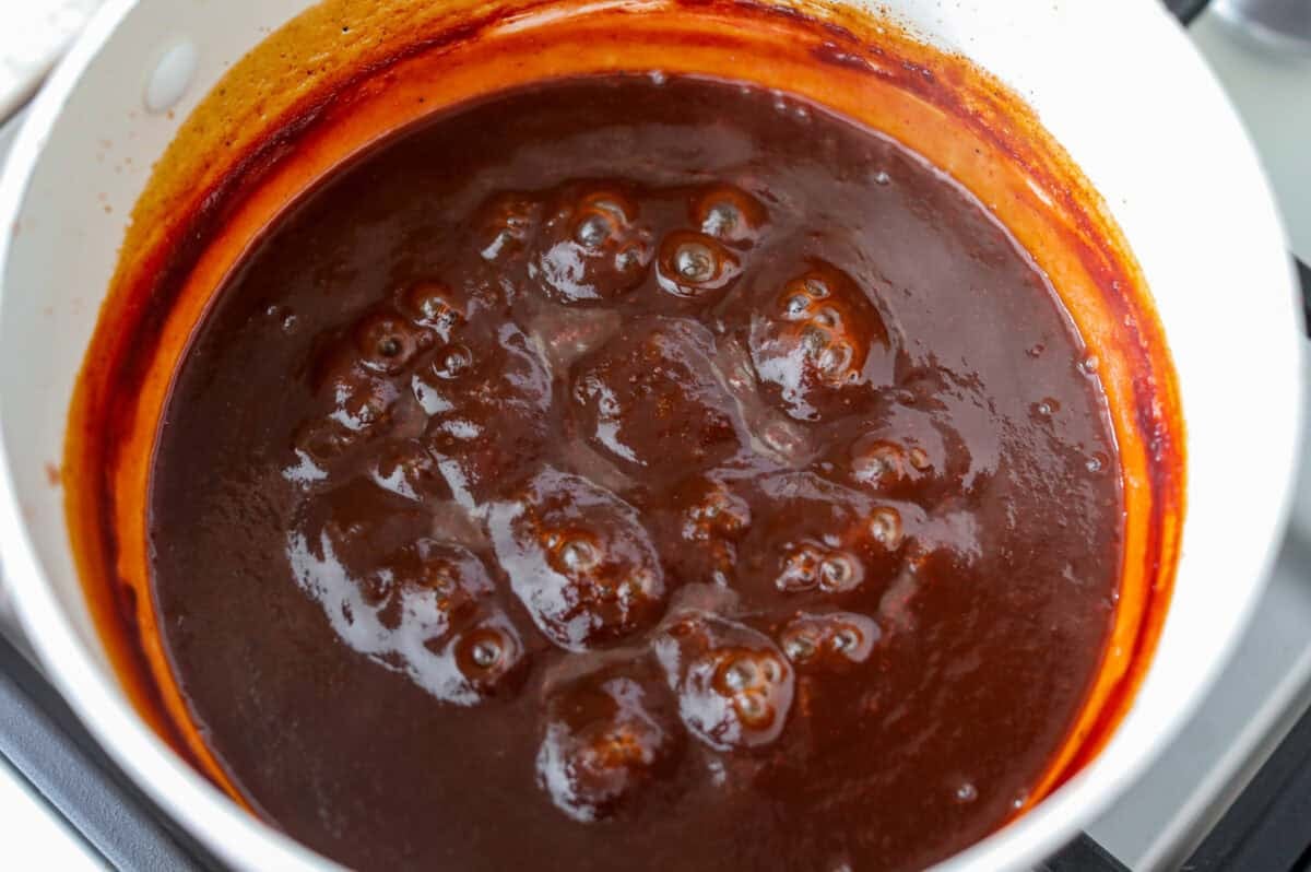 Sauce thickened and simmering in the pot. 