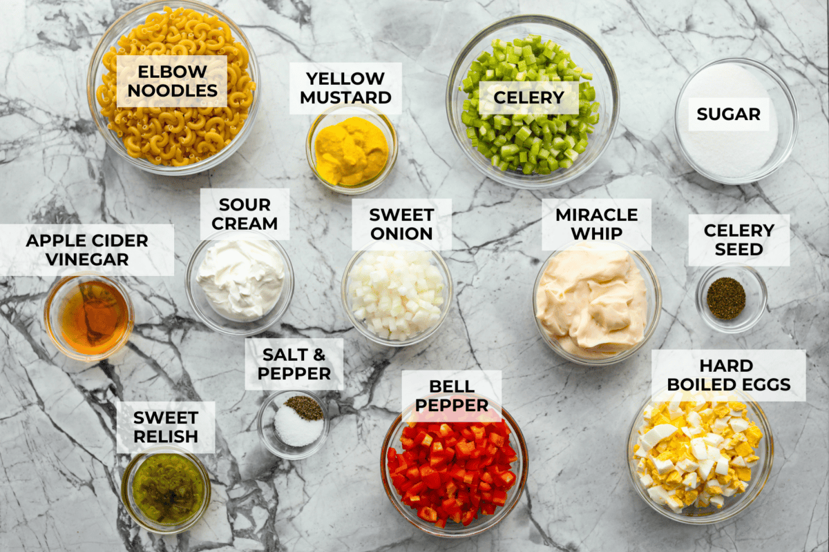 Overhead shot of labeled amish macaroni salad ingredients. 